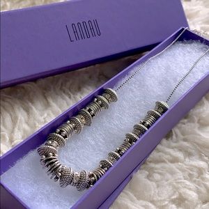 Landau charm silver and faux diamond necklace